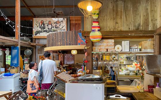 Kaneyo Art Cafe has a wood cabin feel and is filled with paintings, sculptures, books and natural light coming from all directions.