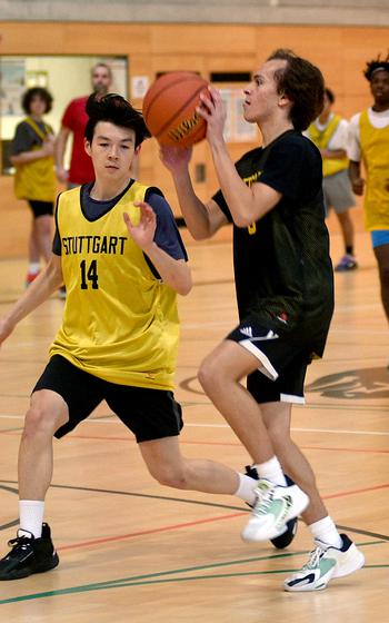 Ryan Stevenson goes up to make a pass during a Stuttgart boys basketball practice on Jan. 31 at Stuttgart High School in Stuttgart, Germany.