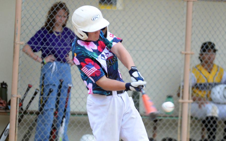 Kubasaki's Lukas Gaines connects for a base hit against Kadena during Friday's Okinawa baseball game. The Dragons won 19-0.