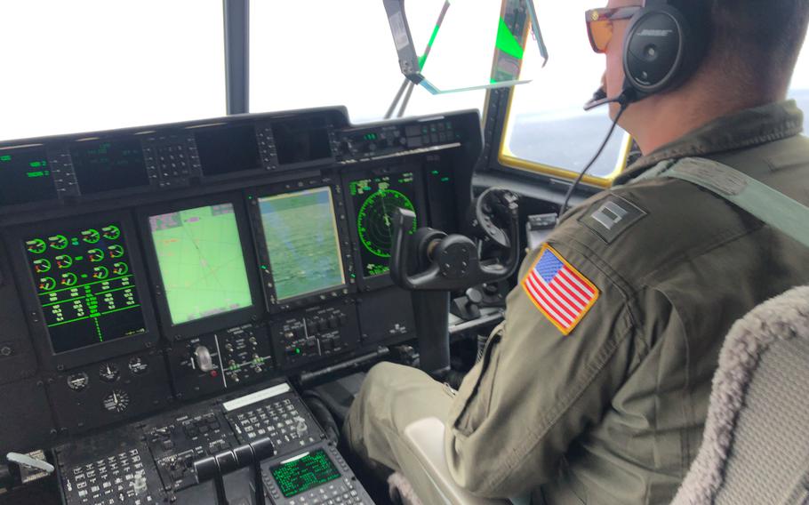 Coast Guard Air Station Elizabeth City, North Carolina crewmembers aboard an HC-130 Hercules airplane aid in the search for the 21-foot submersible, Titan, approximately 900 miles East of Cape Cod, on June 21, 2023. U.S. Coast Guard officials have said specialists would continue to remotely survey the scattered debris located several hundred feet off the Titanic’s bow, even though the mission was expected to “demobilize” by midday Friday. 