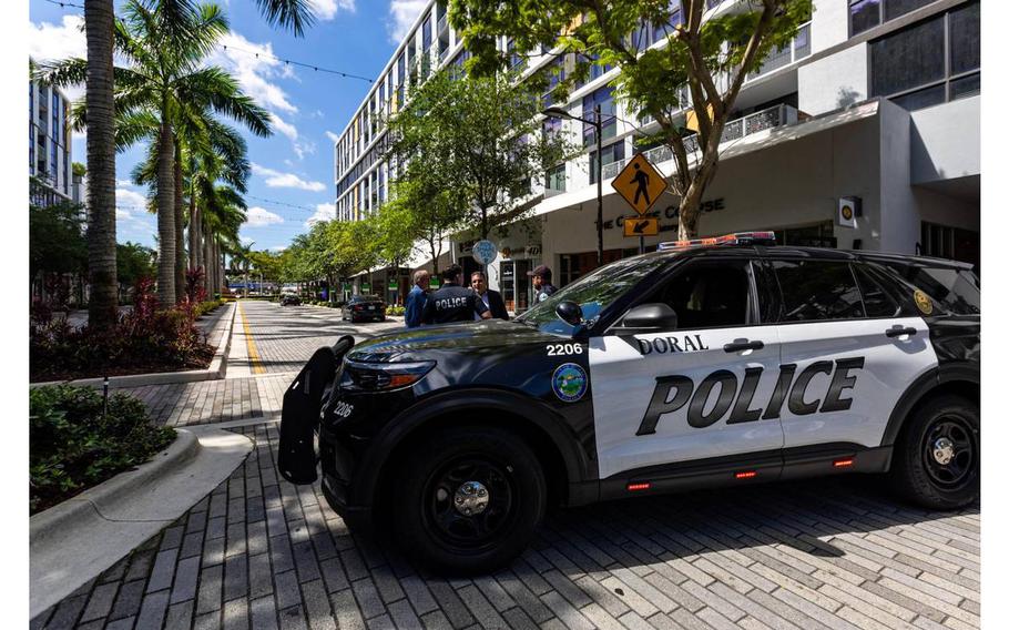 Police cruisers are stationed before the roundabout inside CityPlace Doral on Saturday, April 6, 2024. 