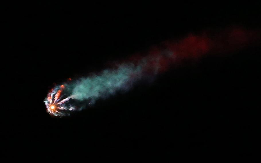 A SpaceX Falcon 9 rocket streaks toward space after lifting off from the Kennedy Space Center, as viewed from Space View Park in Titusville, Florida, on April 27, 2022.