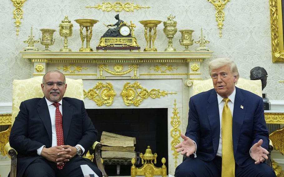 Khalifa and Trump sit next to each other in front of the ornate decor of the Oval Office.