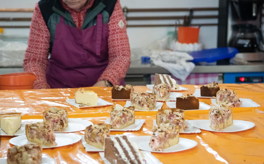 Various cakes are among a range of snacks sold at Zweibruecken’s grass racetrack on the first race day of the year, April 16, 2023. 