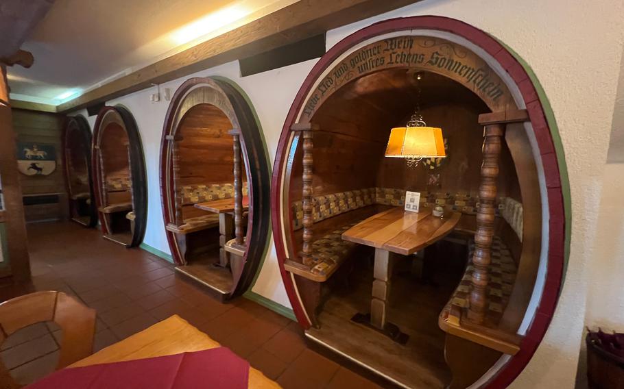 Booths mimicking wine barrels at the Duerkheim Giant Barrel in Bad Duerkheim, Germany. While the main barrel dining room is reserved for groups and special occasions, the restaurant features smaller rustic booths and a large dining room with traditional German flair. 