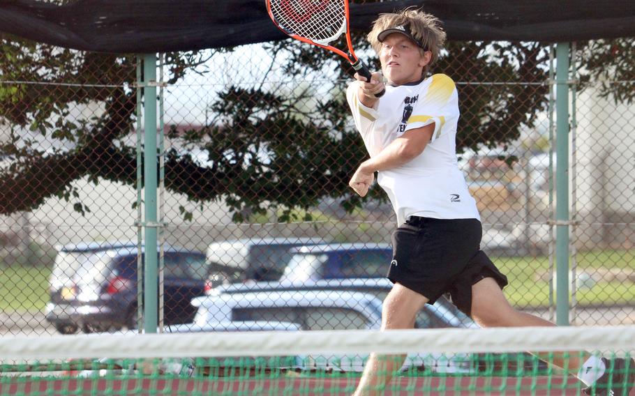 Kadena's Iain Stanley rips a forehand return during his 8-6 win over Kubasaki's Jacy Fisk in Wednesday's Okinawa tennis matches.