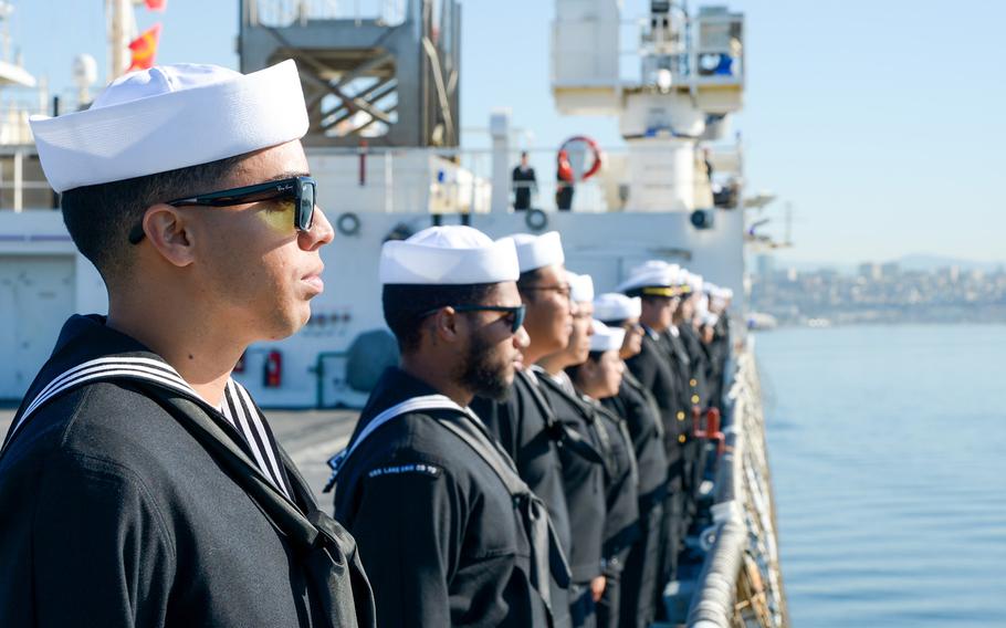 Sailors aboard the hospital ship USNS Mercy (T-AH 19) man the rails as the ship pulls into Naval Air Station North Island, California, on Feb. 12, 2024. 