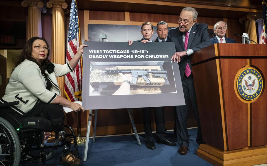 From left, Sens. Tammy Duckworth, Richard Blumenthal, Alex Padilla, Senate Majority Leader Charles E. Schumer and Edward J. Markey speak during a news conference in Washington on Thursday urging the Federal Trade Commission to investigate the marketing of a JR-15 rifle toward children. 