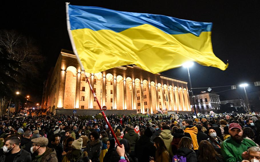 Demonstrators wave the Ukrainian flag during a rally in support of Ukraine in Tbilisi, Georgia, on March 1, 2022. 