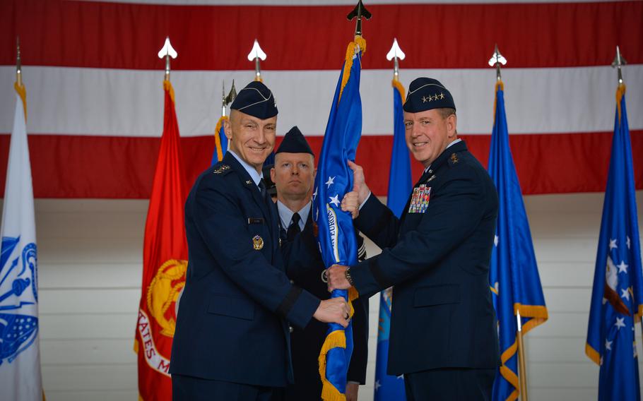 Air Force Vice Chief of Staff Gen. David W. Allvin passes the U.S. Air Forces in Europe and Air Forces Africa guidon to the units new commander, Gen. James B. Hecker, on June 27, 2022, at Ramstein Air Base, Germany. Hecker also assumed duties as the commander of Allied Air Command at Ramstein and director of the Joint Air Power Competence Center in Kalkar, Germany.