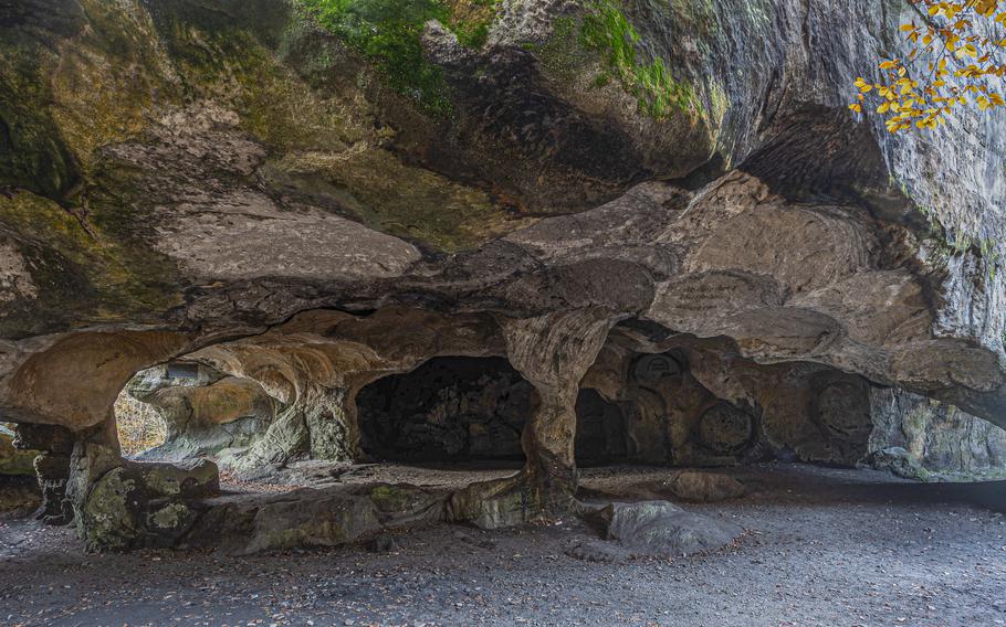 Circular indentations in the walls and roof of Huel Lee cave near Berdorf, Luxembourg, attest to its past as a source of millstones. The cave is one of numerous scenic stops on Luxembourg's E1 trail, an 8.4-mile loop between Berdorf and Echternach.