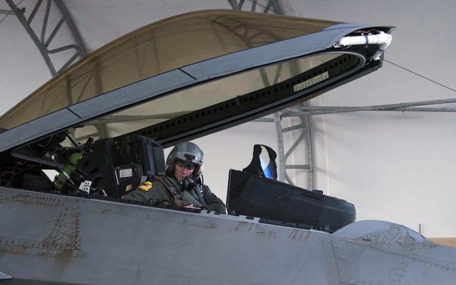 U.S. Air Force Capt. Nichole Vapor Ayers, an F-22 Raptor pilot, performs preflight checks at Joint Base Langley-Eustis, Va., in 2020. The Air Force plans to provide an improved in-flight bladder relief device to fighter pilots by the spring, the service announced this week.