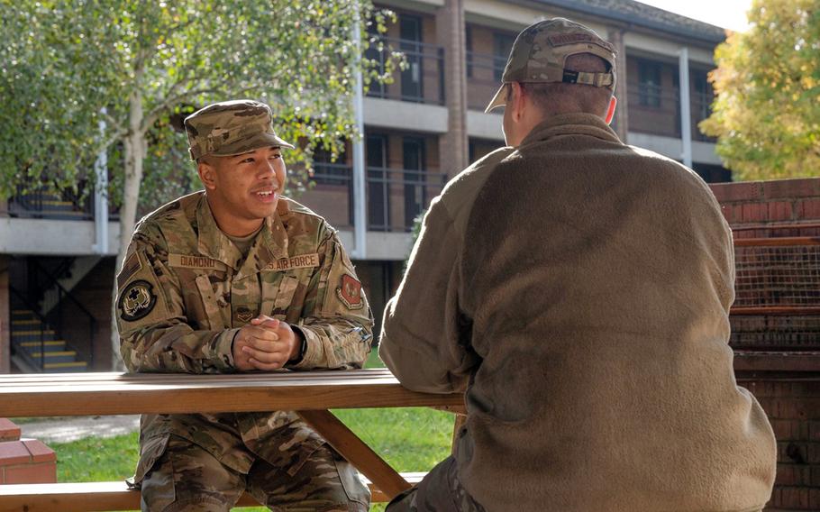 Airmen have a discussion during a mentorship session at Royal Air Force Lakenheath, England, Oct. 22, 2021.