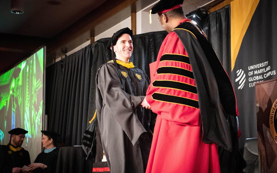 Army Maj. Jacob Lynn receives his master’s degree in software engineering at a ceremony on Ramstein Air Base, Germany, Saturday, April 29, 2023.