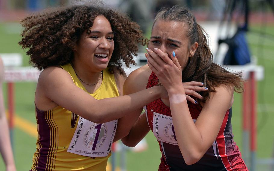 Vilseck’s Mazie Lorcher, congratulates an emotional Alexandra Beck of Kaiserslautern, after Beck won the girls 800-meter race in 2 minutes, 25.02 seconds at the 2025 DODEA-Europe track and field finals in Kaiserslautern, Germany, May 23, 2025. Lorcher finished second.