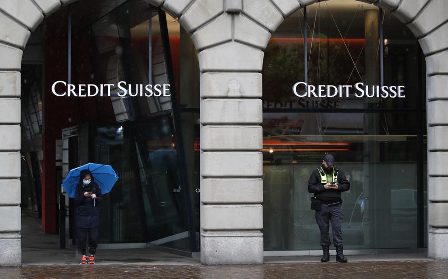 A police officer outside a Credit Suisse Group bank branch in Zurich on July 13, 2021. 
