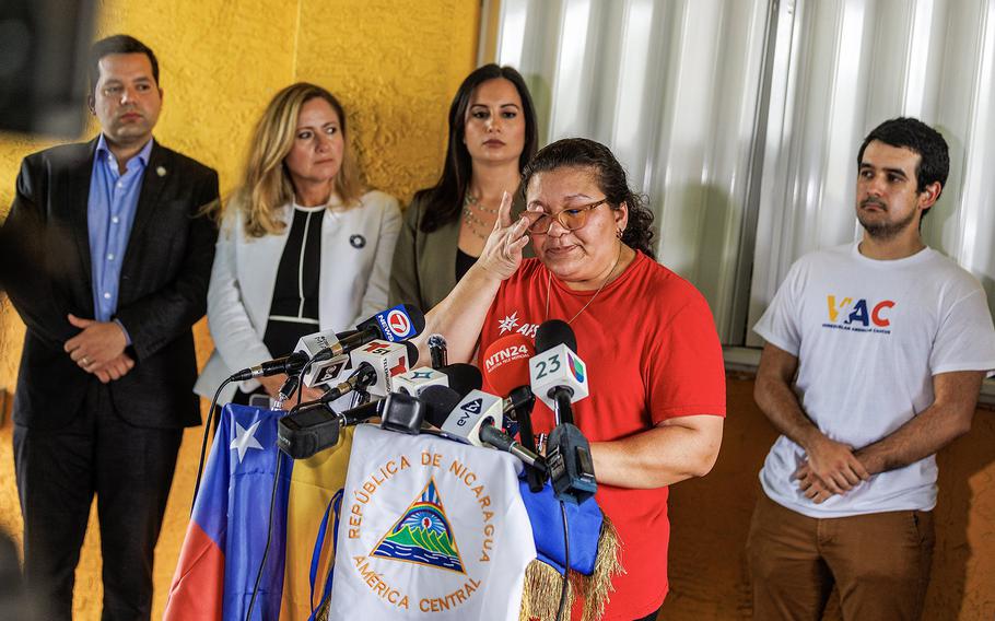 Bertha Sandles reacts as she tells her family story during a press conference at El Arepazo in Doral, Florida, called by the AFSC, FLIC and the Venezuelan American Caucus, as the Nicaraguan and Venezuelan communities continue asking the president to use his executive power to protect more than 700,000 families in Florida. on  Tuesday, Aug. 15, 2023. 