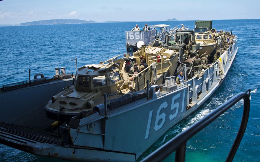 A landing craft exits the well deck of the amphibious dock landing ship USS Tortuga in 2013. The Tortuga is one of three amphibious ships being retired next year by the Navy.