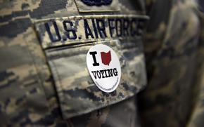 A U.S. Airman assigned to the 180th Fighter Wing in Swanton, Ohio wears a voting sticker on election day Nov. 8, 2016. (U.S. Air National Guard photo by Staff Sgt. Shane Hughes)