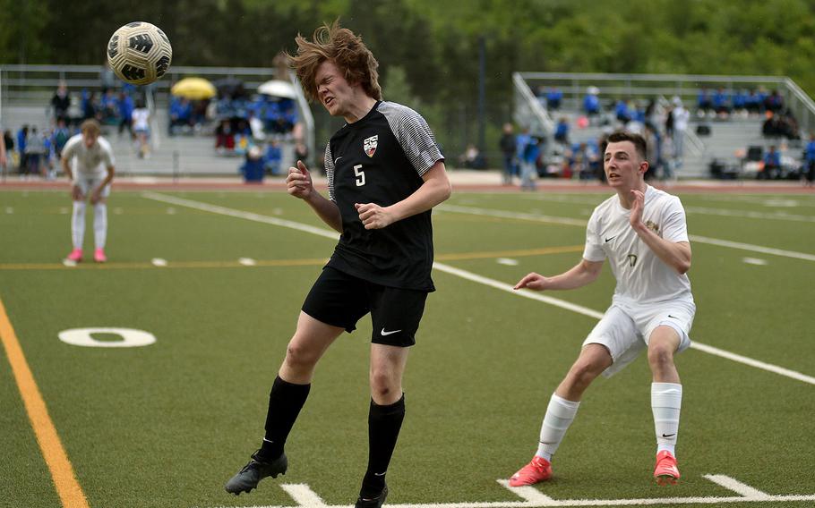 Stutttgart winger Connor Eaton heads a ball ahead of Ramstein midfielder Kai Woodstock during a match April 27, 2024, at Stuttgart High School in Böblingen, Gemany.