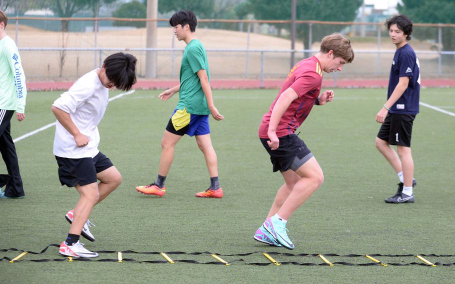 Senior captain Dean Lentz, in red, is hoping that his Daegu boys soccer team can take things more seriously this season.