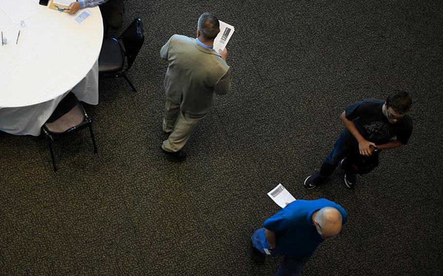 Job seekers attend a Job News USA career fair in Louisville, Ky., on June 23, 2021. 