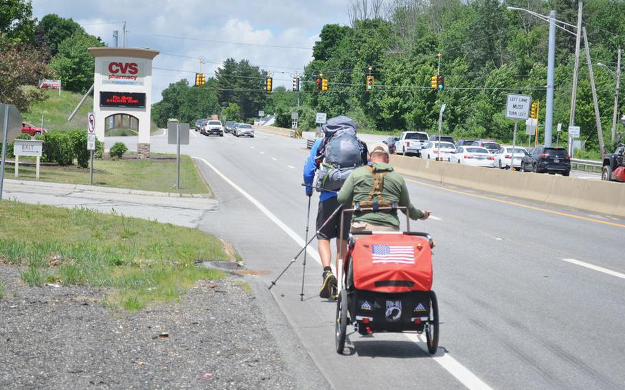Justin Lehew and Coleman Kinzer are just starting out on a journey by foot along Route 20 from Boston to Oregon to raise awareness for U.S. service personnel killed overseas and considered missing in action. 