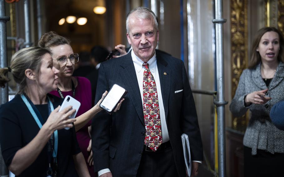 Sen. Dan Sullivan (R-Alaska) walks to a policy lunch on Capitol Hill on Dec. 5, 2023. 