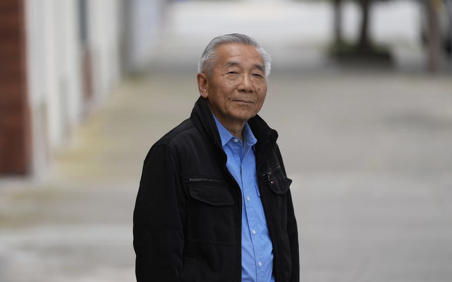 William Fong poses for photos.