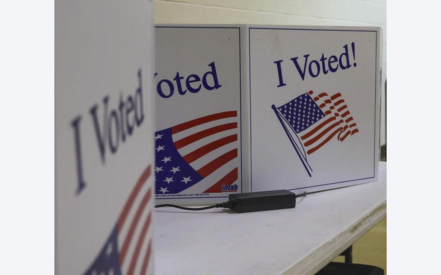 Voting machines are lined up in an election precinct on Nov. 2, 2021.