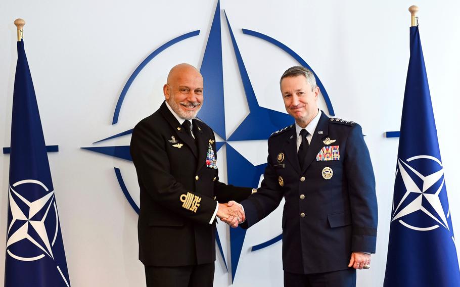 Italian Adm. Giuseppe Cavo Dragone, chairman of NATO’s military committee, shakes hands with Chairman of the Joint Chiefs of Staff Gen. Dan Caine on May 14, 2025, at NATO headquarters in Brussels.
