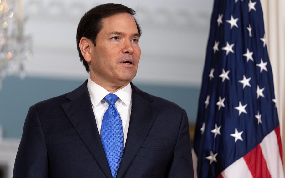 Secretary of State Marco Rubio speaking in front of an American flag.