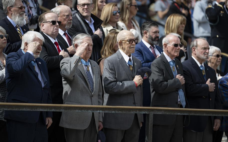 Medal of Honor recipients put their hands over their chest and salute