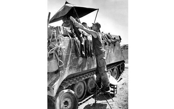 South Vietnam, November, 1968:  Pfc. Carroll G. Steeve, of 3rd Platoon, A Company, 2nd Battalion, 47th Infantry, 1st Brigade, 9th Infantry Division, takes time out from the war to do some laundry, using the best substitute he could find for a clothesline.

Looking for Stars and Stripes’ coverage of the Vietnam War? Subscribe to Stars and Stripes’ historic newspaper archive! We have digitized our 1948-1999 European and Pacific editions, as well as several of our WWII editions and made them available online through https://starsandstripes.newspaperarchive.com/

META TAGS: Vietnam War; military life; 2nd Battalion, 47th Infantry Regiment, 1st Infantry Brigade, 9th Infantry Division; U.S. Army