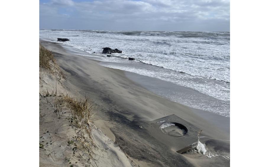 Erosion is continuing to exhume portions of a Cold War military site on North Carolina’s Outer Banks, resulting in Cape Hatteras National Seashore closing additional sections of beach.