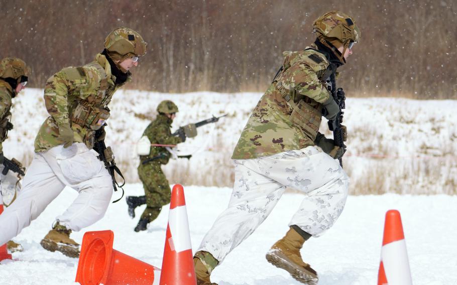 U.S. and Japanese soldiers train together during the North Wind exercise at Camp Higashi Chitose, Hokkaido, Friday, Jan. 26, 2024. 