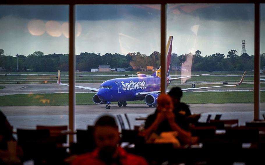 A Southwest Airlines plane taxis to the gate at Hobby Airport in Houston on March 20, 2020. 