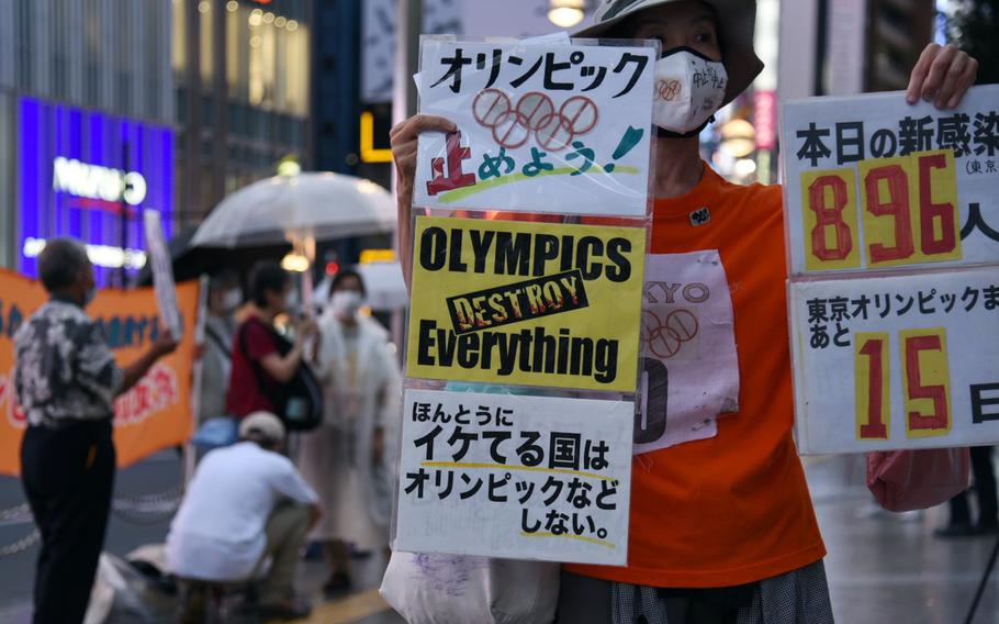 Anti-Olympics protestors hold a demonstration in central Tokyo, Thursday, July 8, 2021, the same day Japan's prime minister announced a fourth coronavirus state of emergency for the capital. 