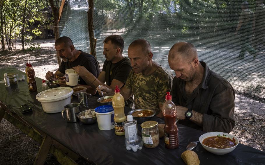 Troops from the 47th have a lunch of borscht after working on Bradley Fighting Vehicles at the Zaporizhzhia workshop. 