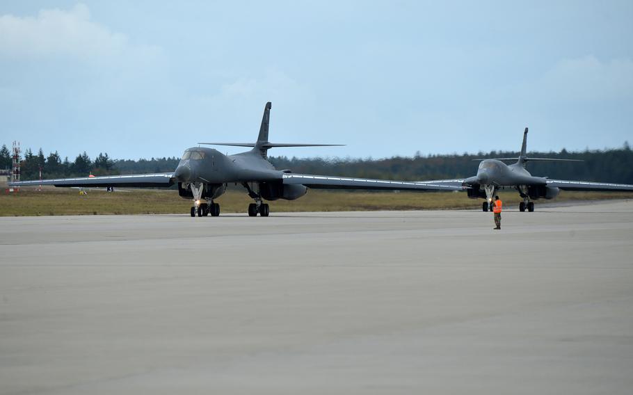 A pair of B-1B Lancer bombers roll down the taxiway after landing at Spangdahlem Air Base, Germany, Oct. 11, 2021. The planes, from the 9th Expeditionary Bomb Squadron, Dyess Air Force Base, Texas, are forward deployed to RAF Fairford, England, and flying missions over Europe. 