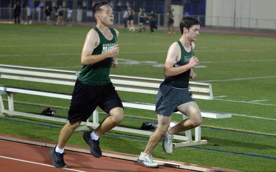 Rei Vives and Marcus Scott run.