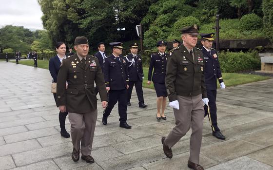 U.S. Army Chief of Staff Gen. James McConville visits a memorial for fallen Japanese soldiers at Camp Ichigaya in Tokyo, Monday, May 8, 2023.