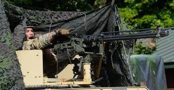 A Security Force Assistance Brigade soldier — known as an advisor — operates a .50-caliber machine gun during a pre-deployment training exercise Aug. 23, 2023, at Muscatatuck Training Center in Indiana. 