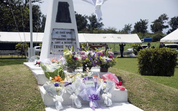 Flowers cover an marking the spot where Ernie Pyle was killed.