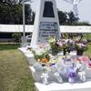 Flowers cover an marking the spot where Ernie Pyle was killed.