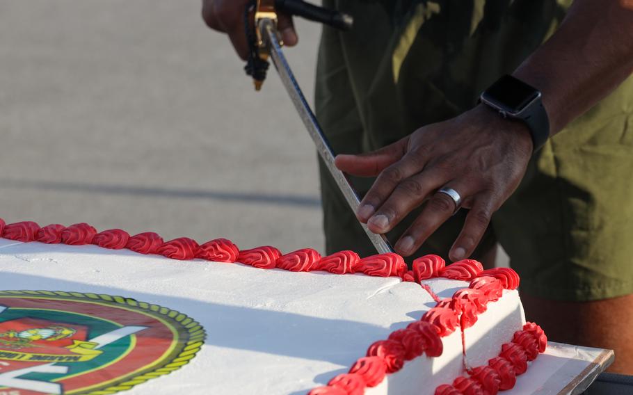 U.S. Marine Corps Col. Andre Ingram, commanding officer of Combat Logistics Regiment 37 (CLR-37), 3rd Marine Logistics Group, cuts the celebratory birthday cake with the traditional mameluke sword during a cake cutting ceremony in honor of the Marine Corps’ 248th Birthday on Camp Kinser, Okinawa, Japan, Nov. 9, 2023. CLR-37 held a motivational run and cake cutting ceremony in honor of the Marine Corps’ 248th birthday.