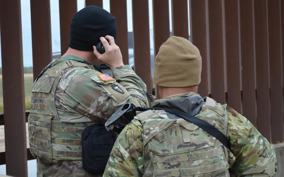 Two Texas National Guard soldiers work Jan. 21, 2022, at an observation post near the state’s border with Mexico as part of Operation Lone Star. The mission began in March with 500 troops and has surged to about 10,000 in the last three months. 