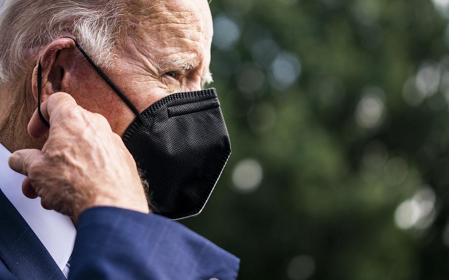 President Biden removes his mask to speak with the press on the South Lawn of the White House on Aug. 26, 2022. 