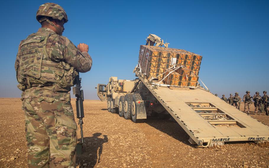 U.S. soldiers conduct a controlled detonation at Al-Asad air base, Iraq, Dec. 29, 2023. An unspecified number of U.S. personnel are being evaluated for traumatic brain injuries, U.S. Central Command said, after a coalition of Iranian-backed militants launched a missile attack Saturday on Al-Asad air base.