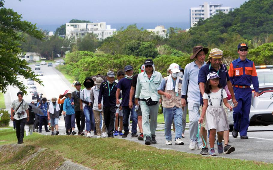 About 100 Okinawans practice evacuating from a tsunami during a drill at Kadena Air Base, Saturday, Sept. 16, 2023. 